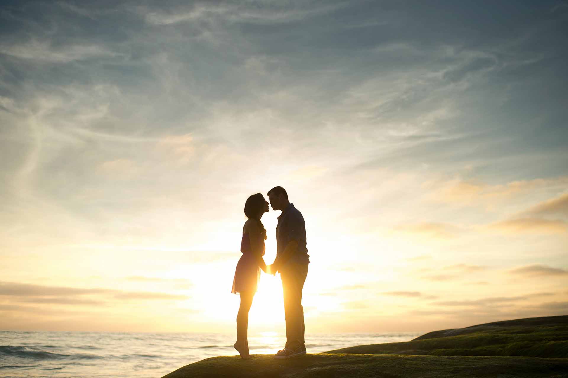 Happy young Singaporean couple with love advice in the sunset | Astrology Whispers by Dave Gor